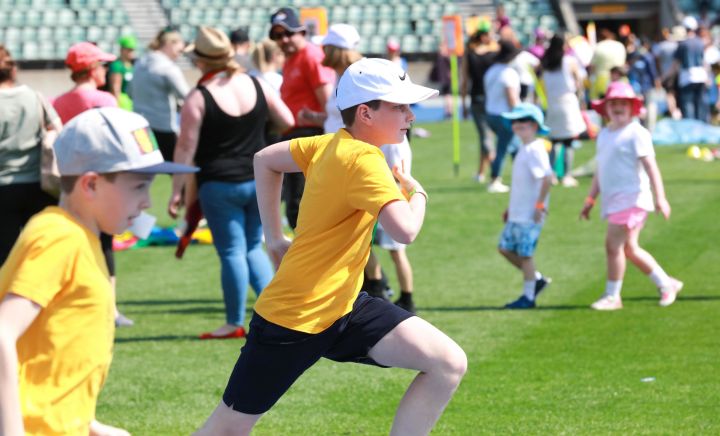 Students race in the stadium at Sports Carnival 2018